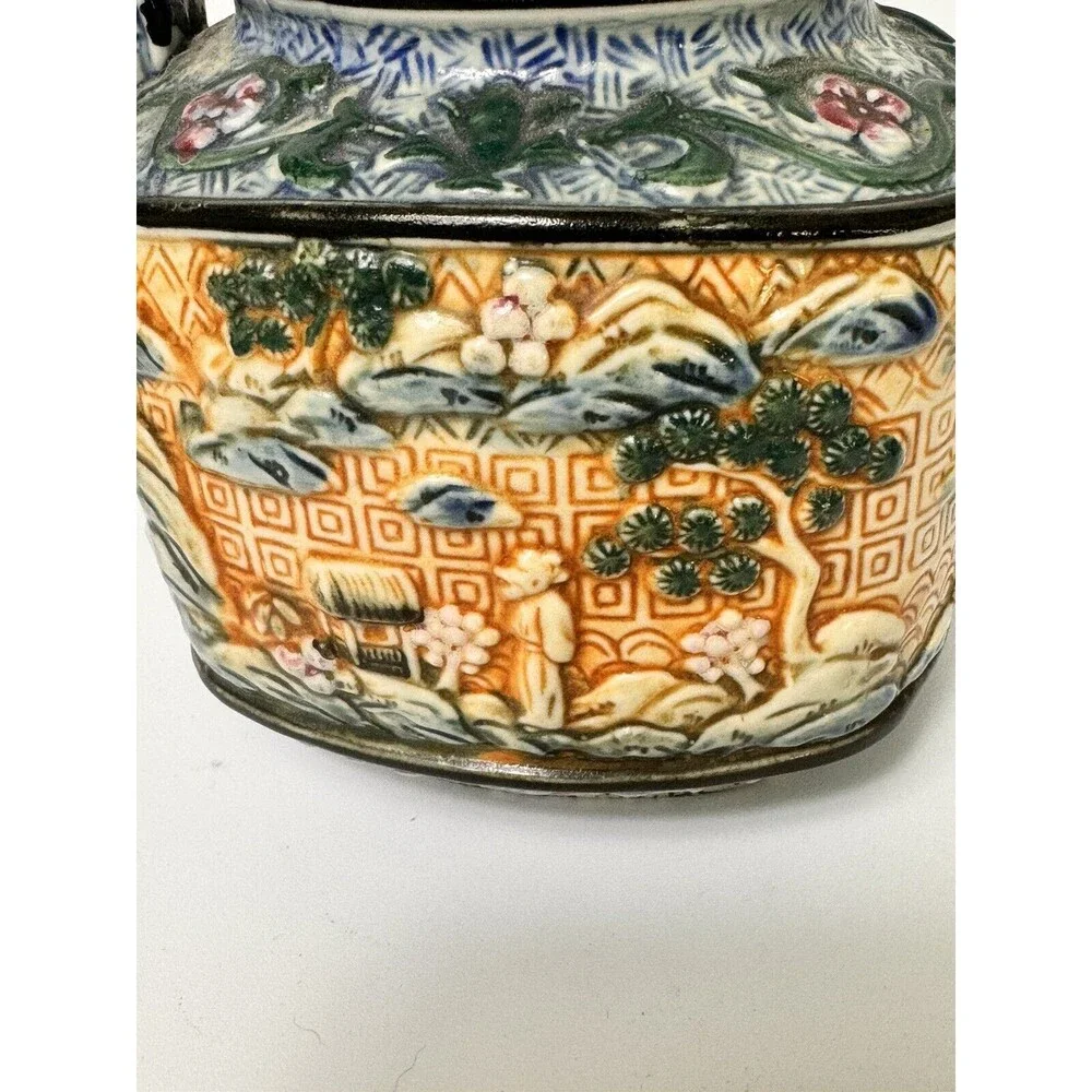 Teapot- vintage ceramic raised Asian  9 inches by 7 Inches